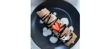 Crepes with strawberries &amp; chocolate Sauce.png