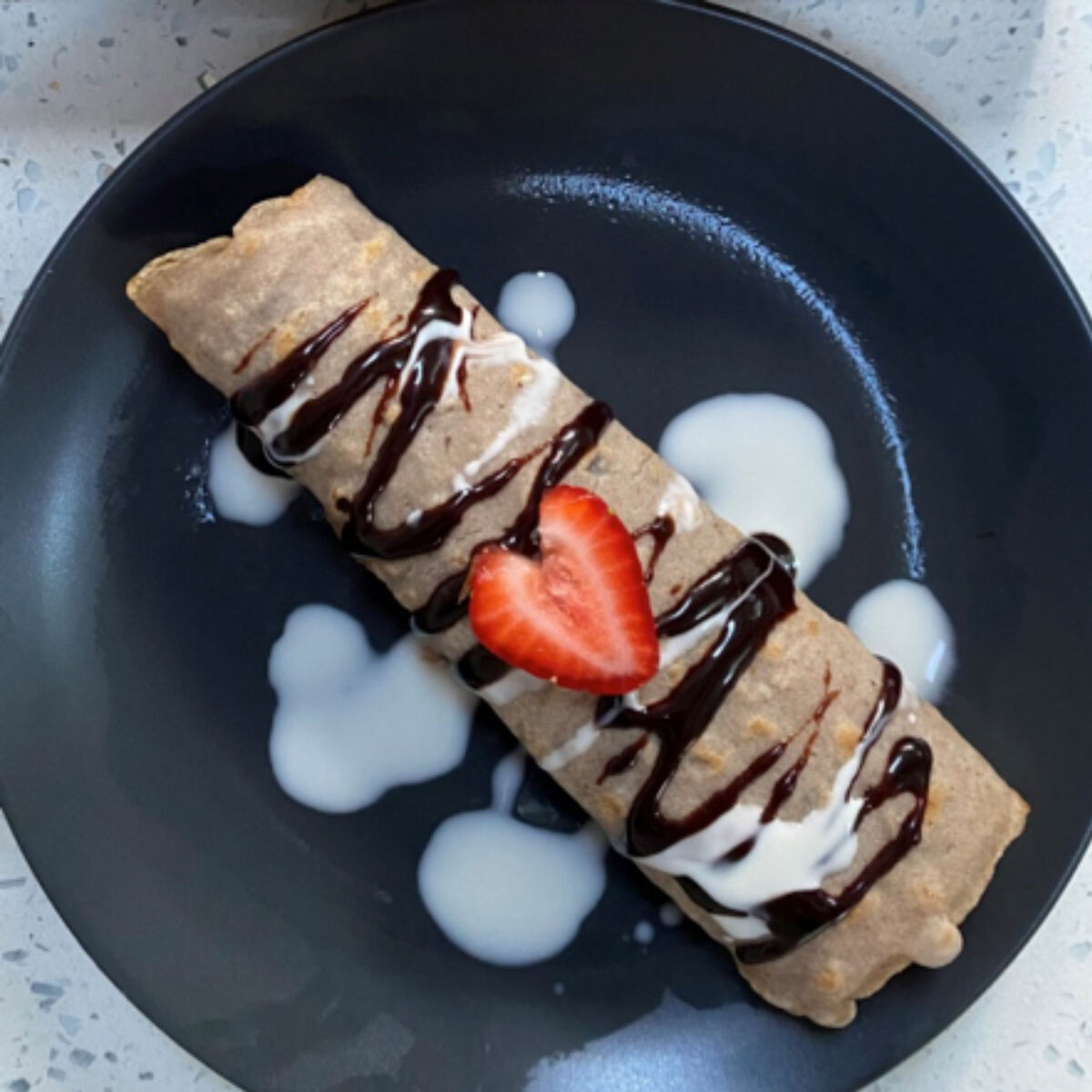 Crepes with strawberries & chocolate Sauce.png